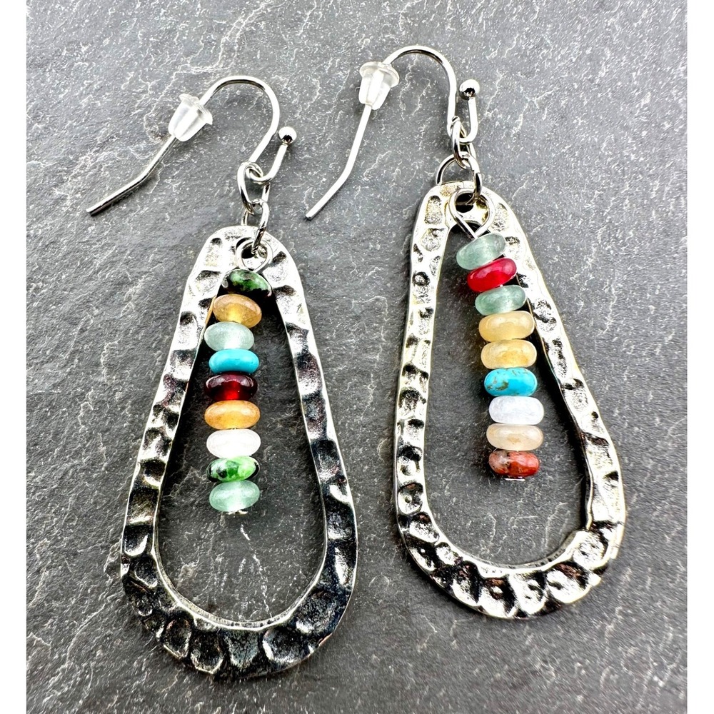 Hammered Silver Tone Teardrop Earrings framing a Rainbow of Glass Beads